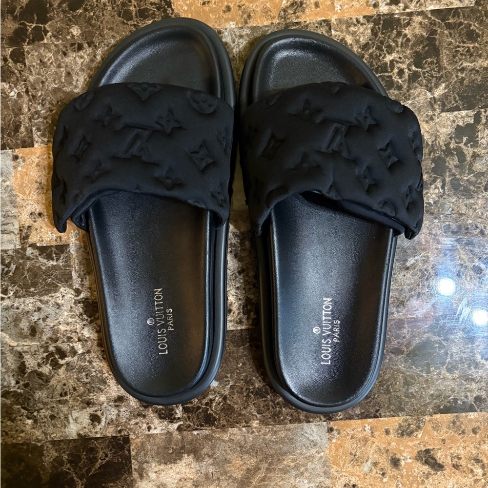 Black Slide Sandals with Ornate Strap and Water-Resistant Material